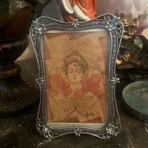 Ornate Silver Picture Frame with Vintage Art